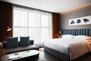 Ein Bett oder Betten in einem Zimmer der Unterkunft RYSE, Autograph Collection by Marriott