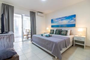 Postel nebo postele na pokoji v ubytování Modern Apartments in Los Corales - Bavaro Beach
