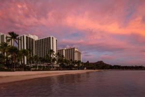 a view of a beach with buildings and palm trees at Waikiki Beach Marriott Resort & Spa in Honolulu