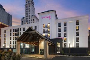a hotel with a sign on the front of it at MOXY Memphis Downtown in Memphis