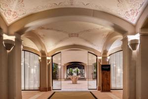 a hallway of a building with a ceiling at Hacienda Son Antem Golf Resort, Autograph Collection in Llucmajor