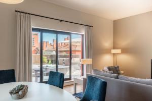 a living room with a couch and a table at Sheraton Cascais Resort - Hotel & Residences in Cascais