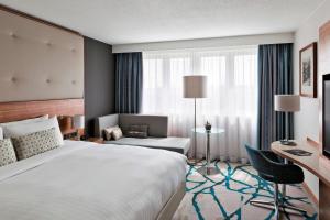 a hotel room with a bed and a desk at Vienna Marriott Hotel in Vienna