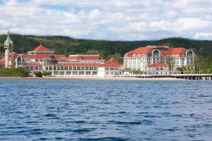 a resort on the shore of a body of water at Sheraton Sopot Hotel in Sopot