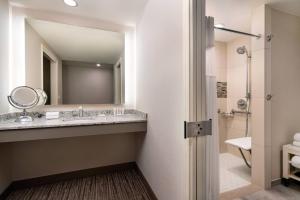 a bathroom with a sink and a mirror at Coronado Island Marriott Resort & Spa in San Diego