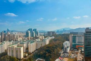 a view of a city with many tall buildings at JW Marriott Hotel Seoul in Seoul