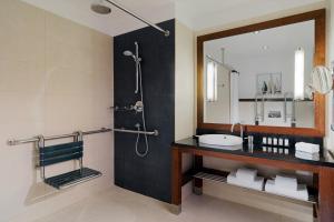 a bathroom with a sink and a mirror at Sheraton Sopot Hotel in Sopot