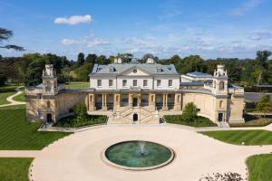 an aerial view of a large mansion with a fountain at The Langley, a Luxury Collection Hotel, Buckinghamshire in Iver