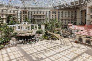an indoor courtyard of a large building with a fountain at Gaylord Palms Resort & Convention Center in Orlando