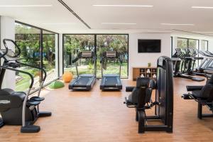 a gym with treadmills and elliptical machines at Pine Cliffs Residence, a Luxury Collection Resort, Algarve in Albufeira