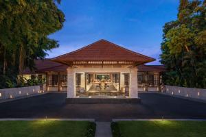 an exterior view of a villa with a garden at The Laguna, A Luxury Collection Resort & Spa, Nusa Dua, Bali in Nusa Dua