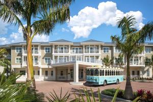 a bus parked in front of a large building at Waterline Villas & Marina, Autograph Collection in Holmes Beach