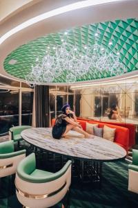a man sitting on a table on a cruise ship at W Mexico City in Mexico City