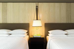 Postel nebo postele na pokoji v ubytování Hua Hin Marriott Resort and Spa