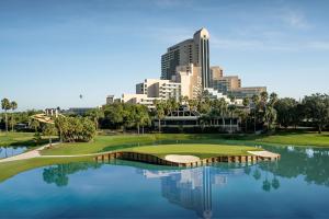 a view of a golf course with a city in the background at Orlando World Center Marriott in Orlando