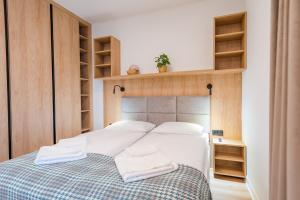 Posteľ alebo postele v izbe v ubytovaní Apartamenty na Uroczysku