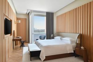 Кровать или кровати в номере The Ritz-Carlton, Doha