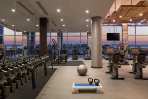 a gym with rows of exercise bikes and shoes in it at The Ritz-Carlton, Doha in Doha