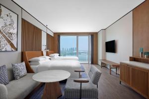 Televiisor ja/või meelelahutuskeskus majutusasutuses Sheraton Zhaoqing Dinghu