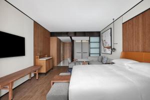Voodi või voodid majutusasutuse Sheraton Zhaoqing Dinghu toas