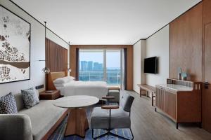 Televiisor ja/või meelelahutuskeskus majutusasutuses Sheraton Zhaoqing Dinghu