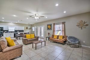 a large living room with couches and a kitchen at Pet-Friendly San Antonio Vacation Rental! in San Antonio