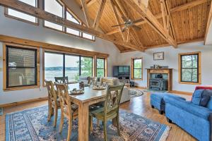 a living room with a wooden table and chairs at Lakehills Vacation Rental on Medina Lake in Lakehills
