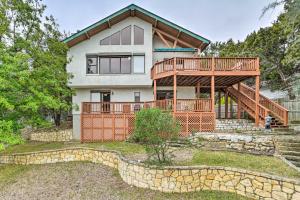 a home with a large deck and a house at Lakehills Vacation Rental on Medina Lake in Lakehills