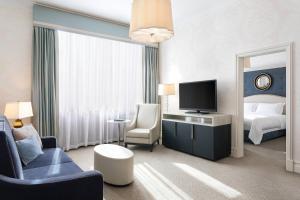 a hotel room with a bed and a television at Hotel Bristol, A Luxury Collection Hotel, Warsaw in Warsaw