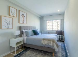 A bed or beds in a room at Moderno, Castro, Corazón de Vigo