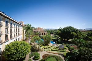 a view of a garden from a building at Costa Rica Marriott Hotel Hacienda Belen in San José