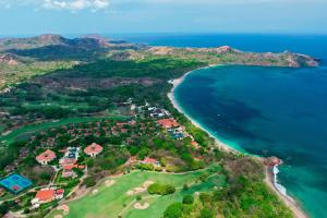 an aerial view of a resort next to the ocean at The Westin Reserva Conchal, an All-Inclusive Golf Resort & Spa in Playa Conchal