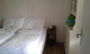 Postel nebo postele na pokoji v ubytování Chalet Sunneggli