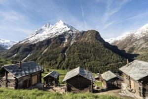 a group of buildings in front of a mountain at Mayen à Olivier in Haudères