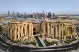 an aerial view of a city with buildings at Le Royal Méridien Doha in Doha