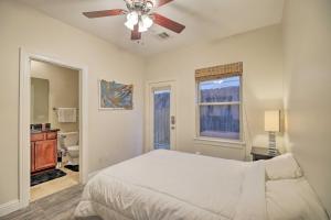 a bedroom with a bed and a ceiling fan at East Dtwn Houston Vacation Rental Near Stadiums in Houston
