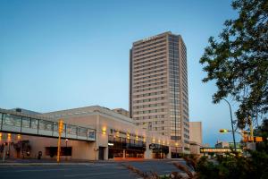 a tall building with a street in front of it at Delta Hotels by Marriott Regina in Regina