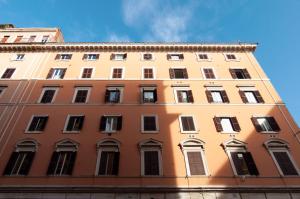 a tall building with many windows on the side of it at Apartment Termini in Rome