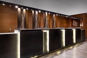 a row of stalls in a building with lights at Hotel AC Baqueira Ski Resort, Autograph Collection in Baqueira-Beret
