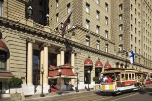 a trolley car in front of a building at The Westin St. Francis San Francisco on Union Square in San Francisco