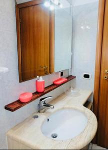 a bathroom with a sink and a mirror at Casa Mirandola in Rome