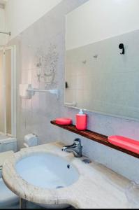 a bathroom with a sink and a mirror at Casa Mirandola in Rome