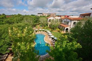 an overhead view of a large swimming pool in a backyard at Hotel Drover, Autograph Collection in Fort Worth