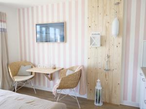 Ένα ή περισσότερα κρεβάτια σε δωμάτιο στο Oceanblue Appartements - Laboe