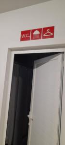 a white door with a sign on top of it at Albergue Santiago Apostol in Logroño