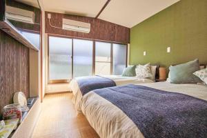 En eller flere senge i et værelse på 58㎡, Max8》5mins to USJ!Good access to downtown!