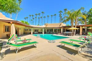 a swimming pool with lounge chairs and a house at ScottsdaleandParadise Valley Estate 2 Mi to Old Town in Scottsdale