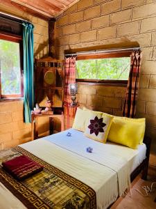 a bedroom with a bed and a window at Kandy Eco Retreat in Kandy