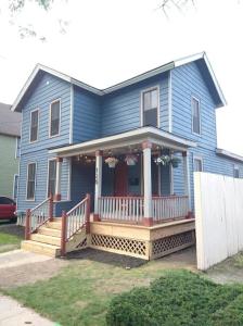 a blue house with a large front porch with a porch at King Bed In Main Floor - Downtown Vacation Rental in Kalamazoo