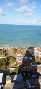 an aerial view of a city and the ocean at Apartamento Duna Barcane 1801 in Natal